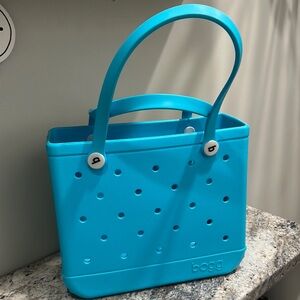 Bogg bag in Aqua Blue color. With small clear bag insert.